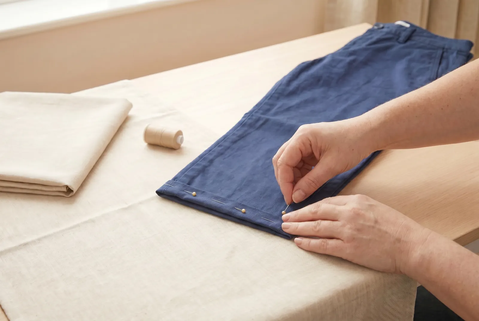 Photo: Fold again along the chalk line so the pressed edge tucks inside, enclosing the raw edge completely.