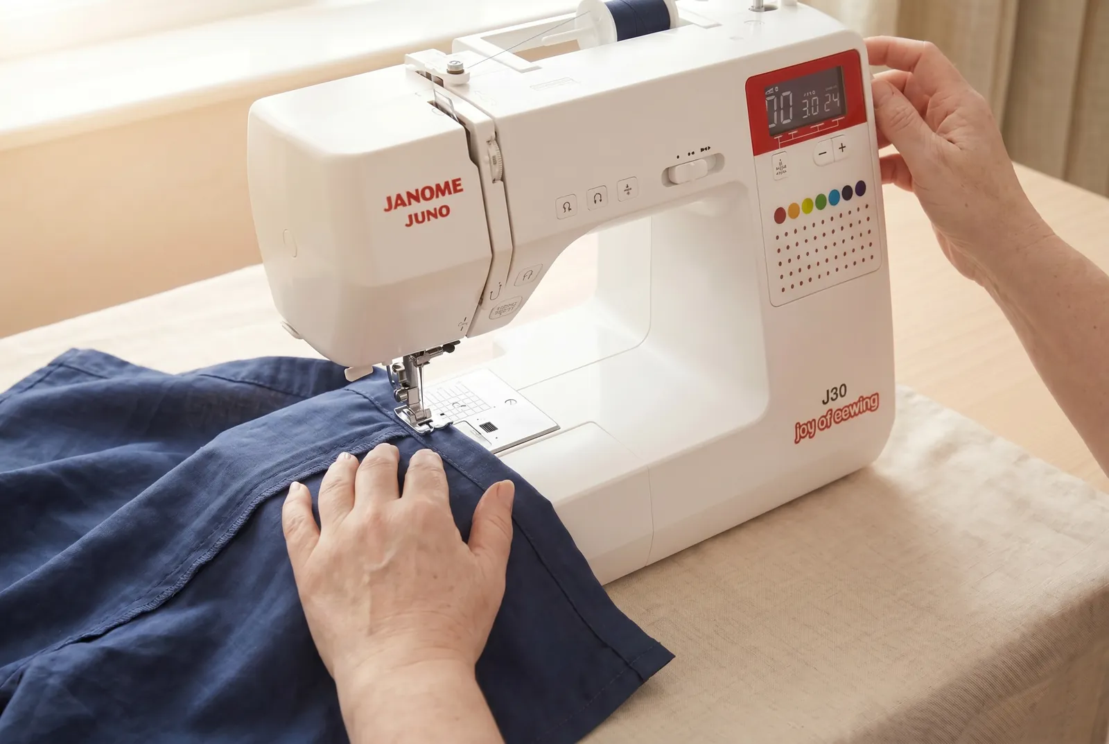 Photo: Working from the inside of the leg, backtack a few stitches with the reverse button, then edge-stitch close to the inner fold all the way around.