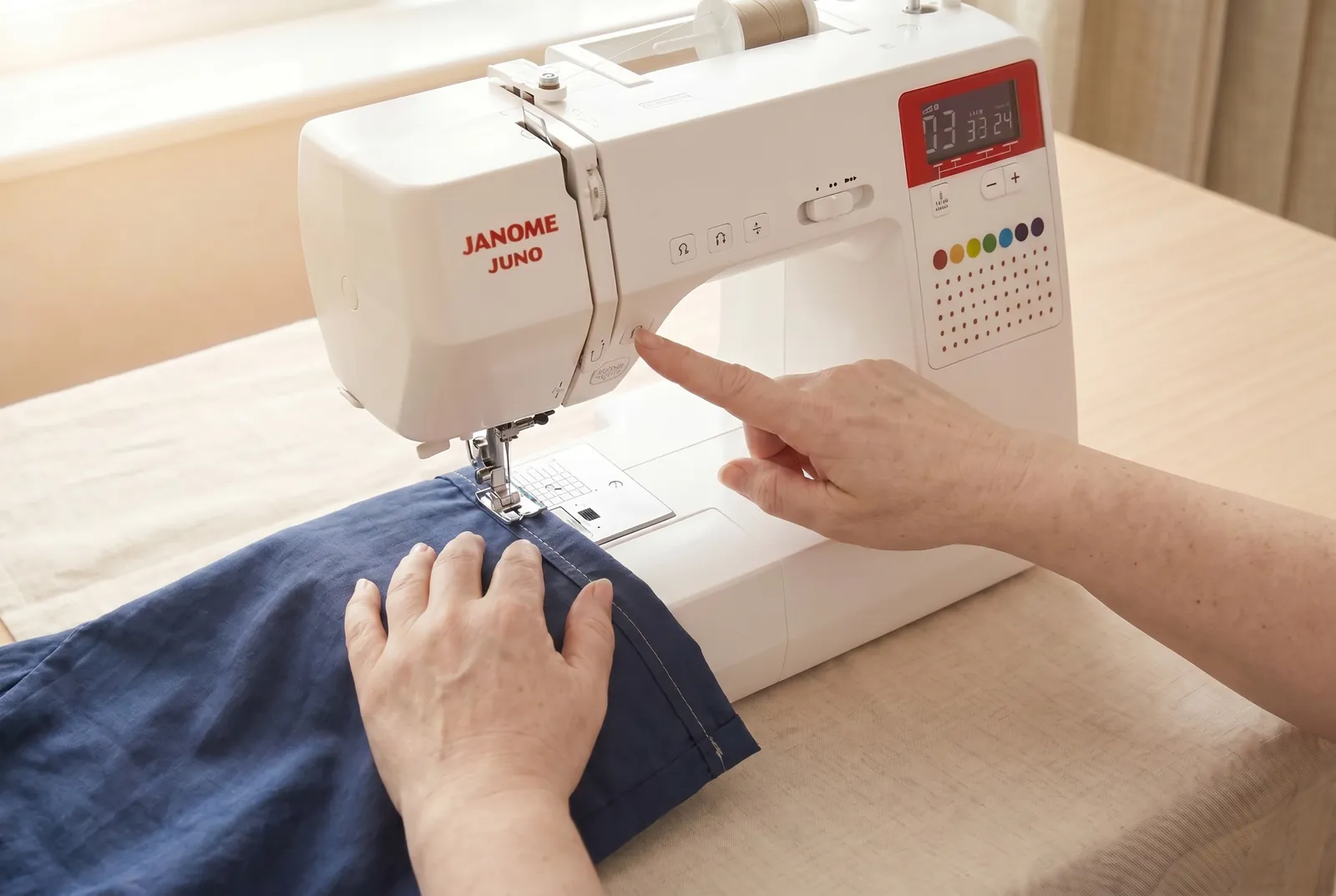 Photo: Sew a little past your starting point, overlap the stitching by about 1 cm (3/8 in), and backtack again to finish off the seam.