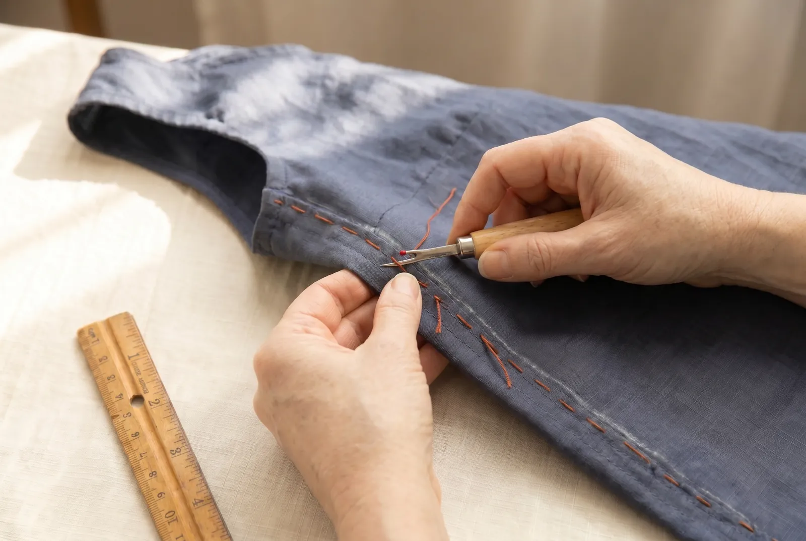 Photo: Take out the basting: cut its thread every few inches and draw out the short lengths.