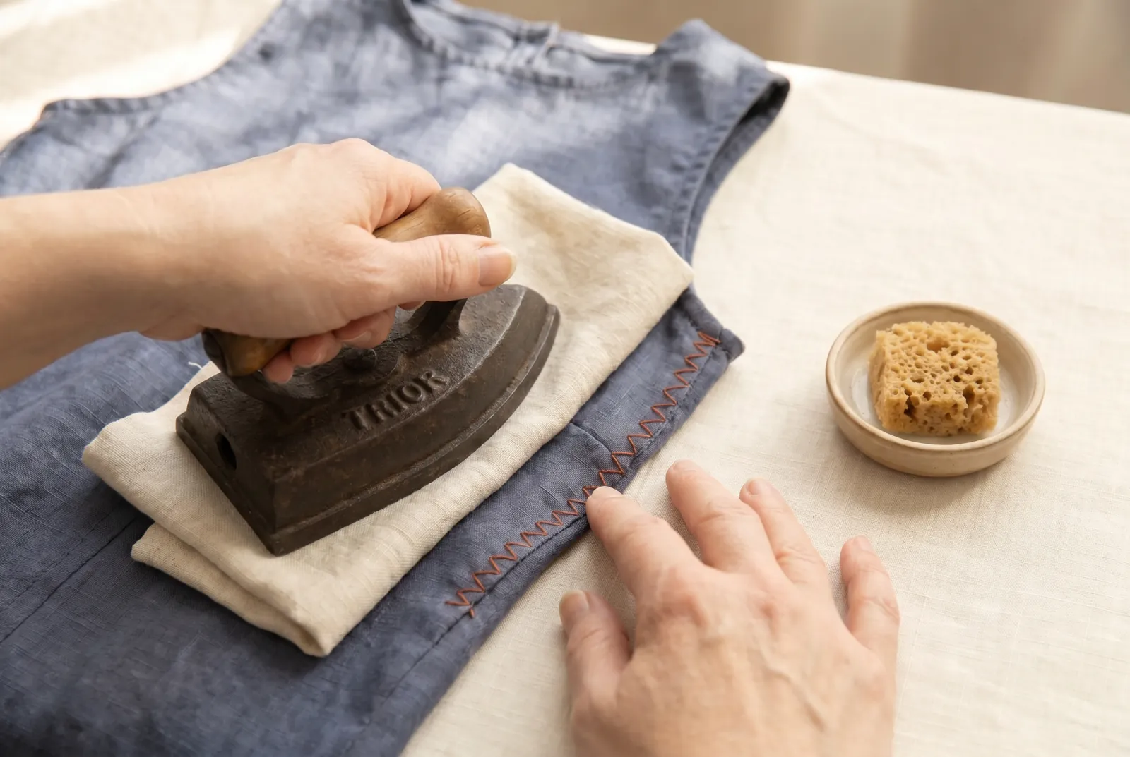 Photo: Check the outside of the garment: after letting out, the old crease line lies on the body side of the new seam, so a faded or needle-marked line can show.