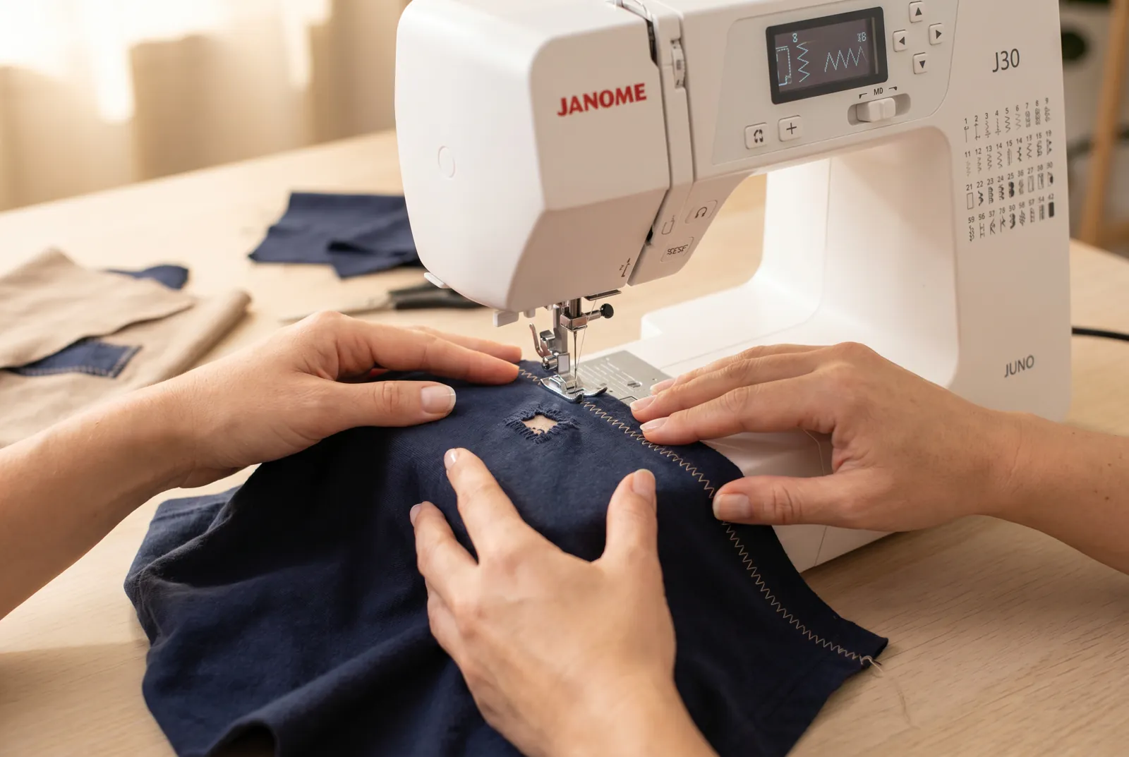 Photo: Turn the garment right side out, set a zigzag stitch (width about 3 mm, length about 1 mm), and stitch back and forth across the hole and around its edge, catc…