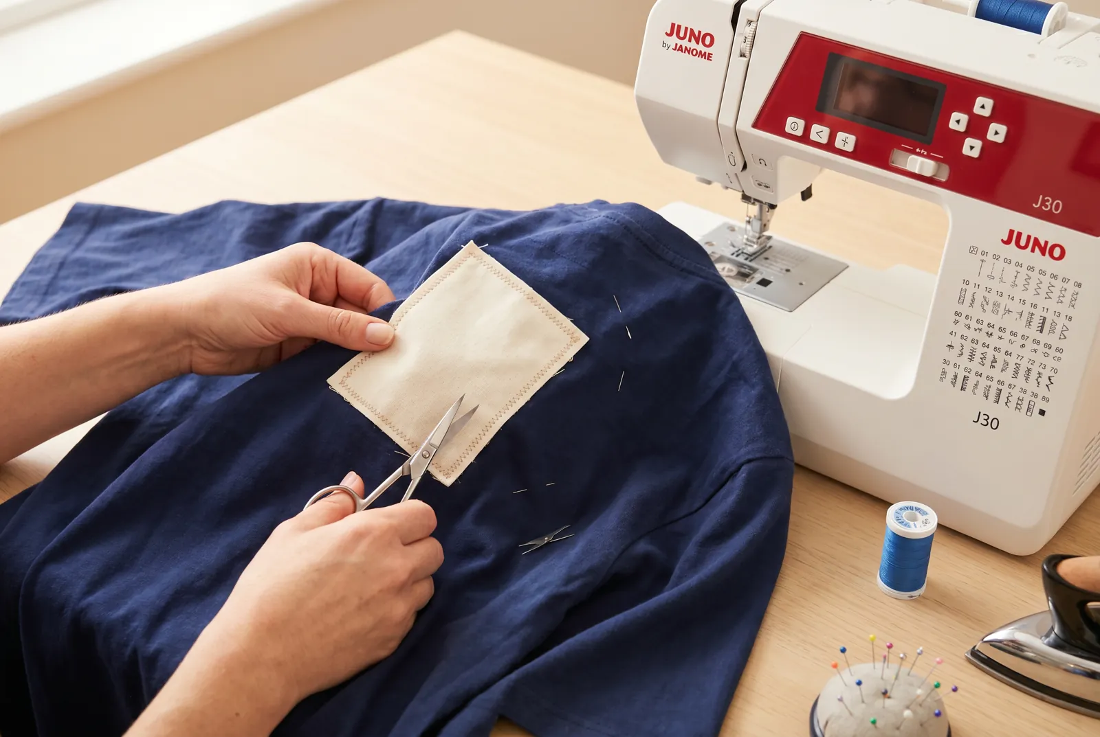 Photo: Turn the garment inside out, trim the patch close to the stitching line, and snip off any loose threads.