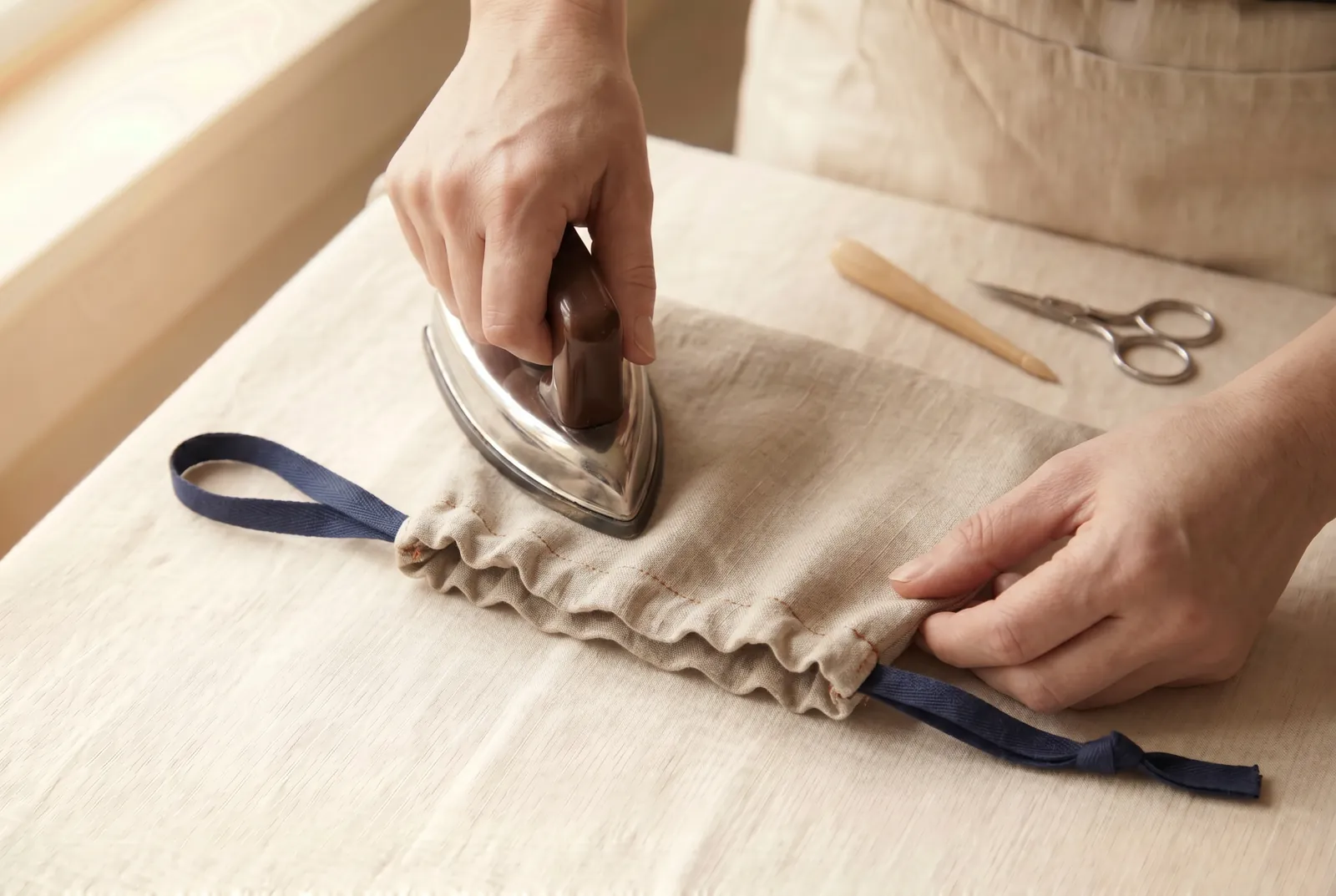 Photo: Press the finished bag flat with the iron, casing and frill smoothed down.