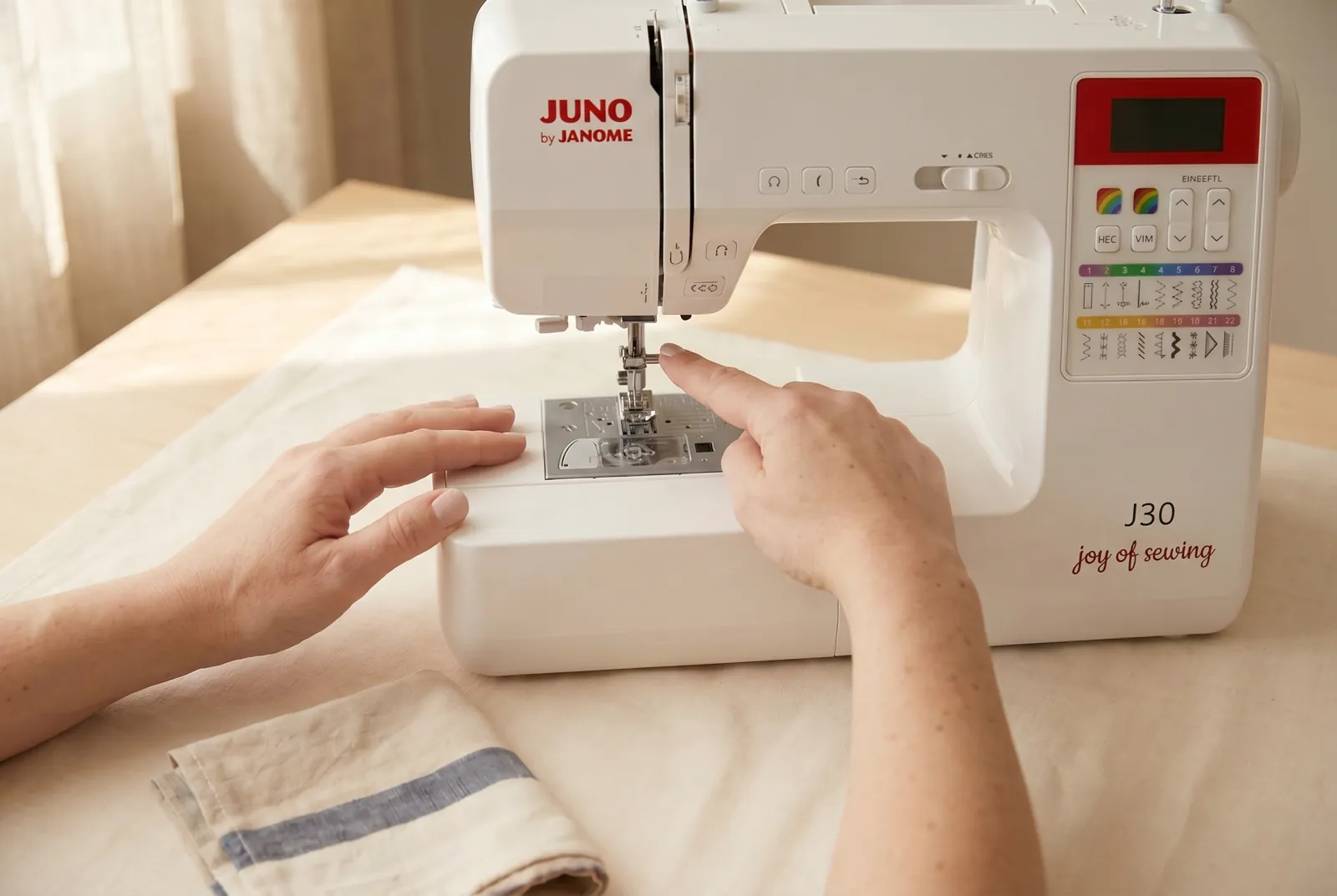 Photo: Find the needle and the needle clamp — the small screw directly above it that holds the needle in place.
