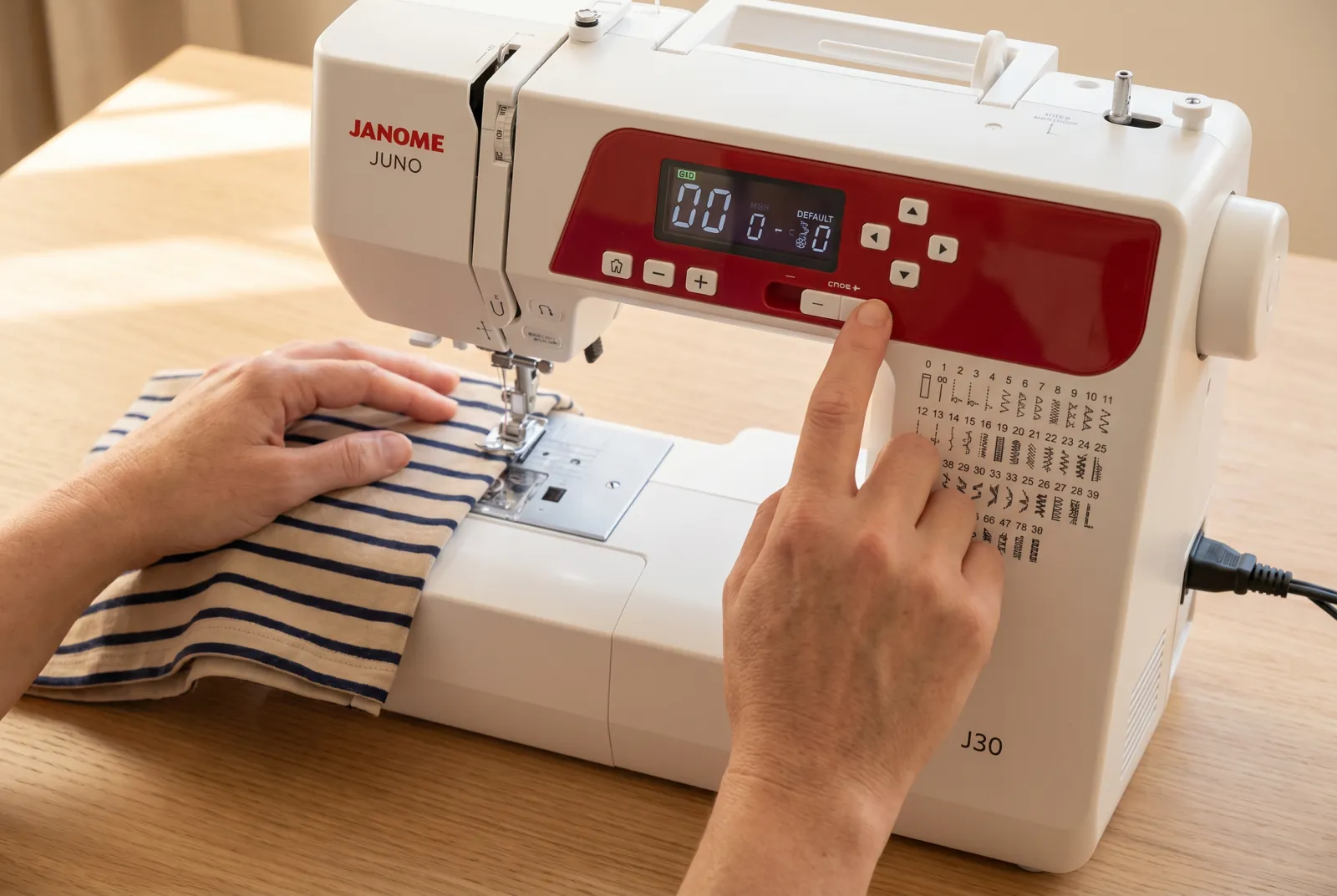 Photo: Turn the machine on and look at the LCD screen above the needle.