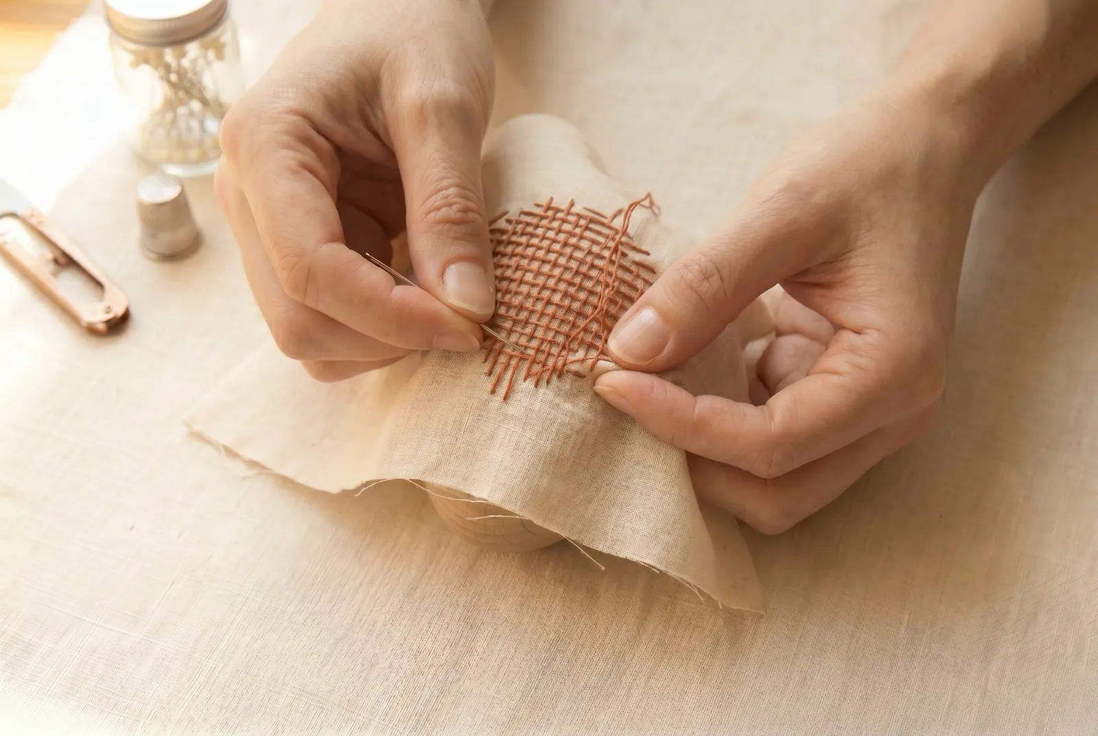 Photo: Let the rows of both darns end unevenly, some longer and some shorter, so the outer edge of the darn does not lie along a single thread of the cloth.