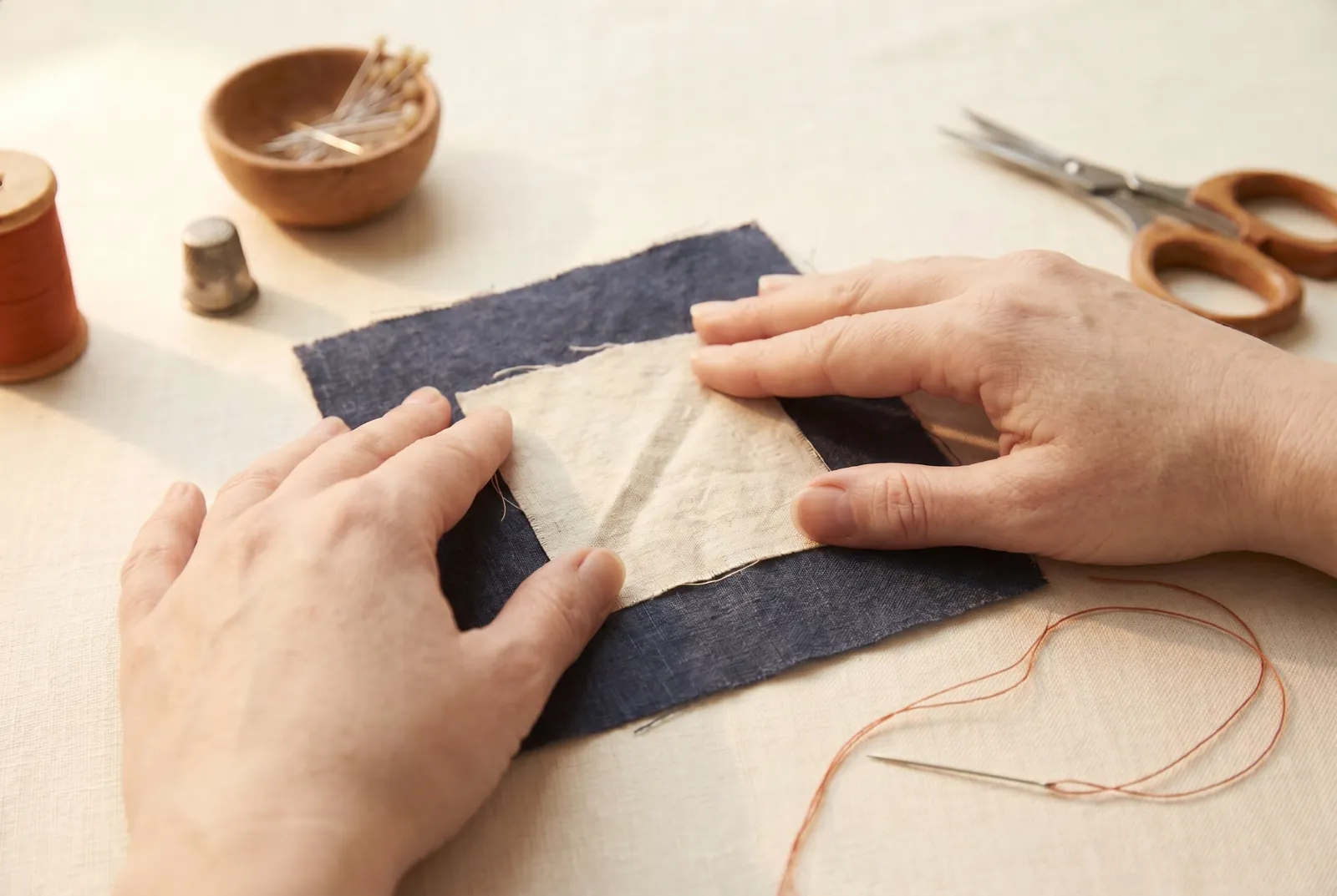 Photo: Bring the two layers together exactly as they will be sewn — a ripped seam laid back together on its old seam line, or a patch centered over the hole or thin p…