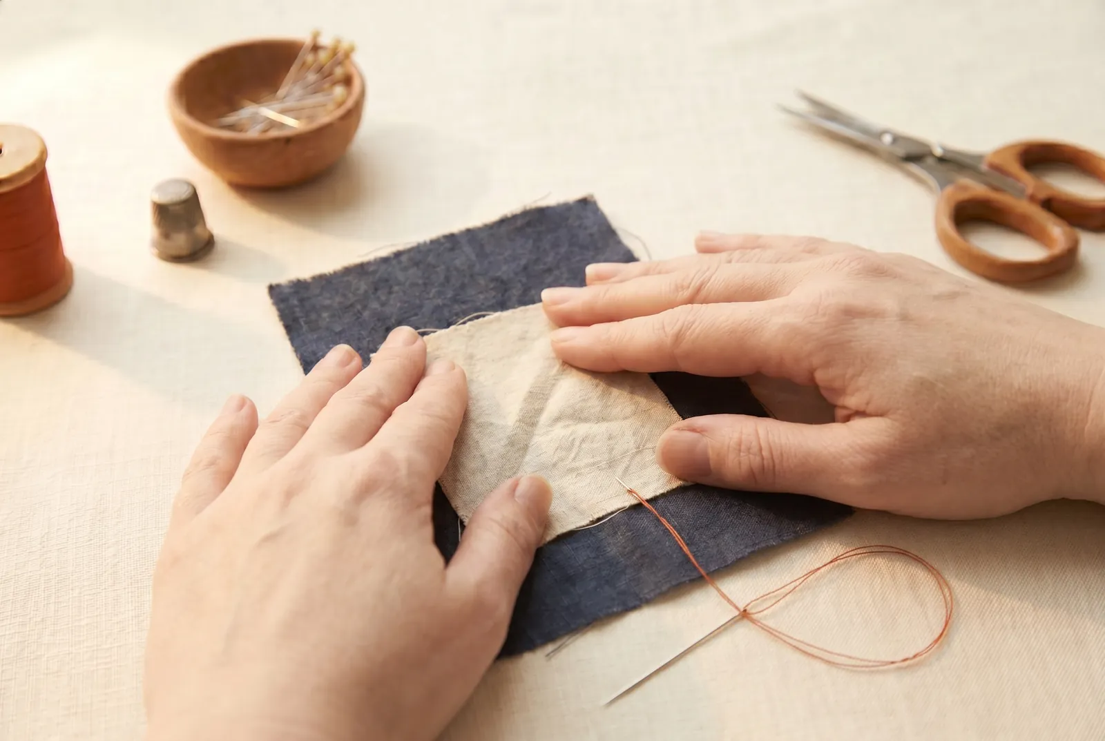 Photo: Check the prepared work against the full sequence — position, baste to hold, then the permanent stitching, which is what actually holds the seam.