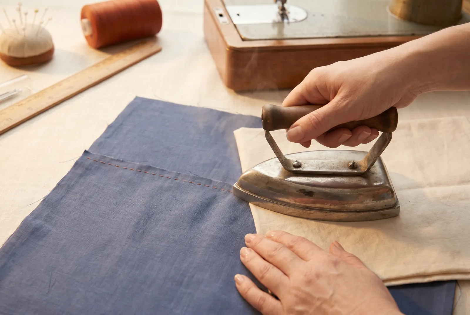 Photo: Press the first seam at once, before any other seam crosses it and while it still opens flat.