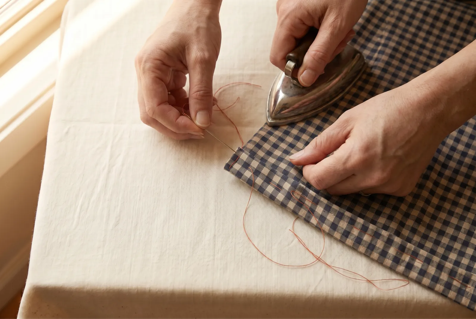 Photo: Hem each side by hand with small slanting stitches that catch only a thread or two of the outer cloth, so the stitches barely show, or stitch close to the fold…