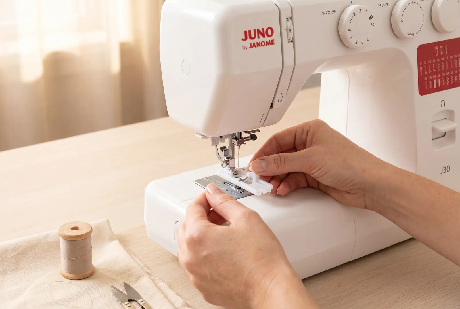 Photo: Snap the automatic buttonhole foot (R) onto the machine.