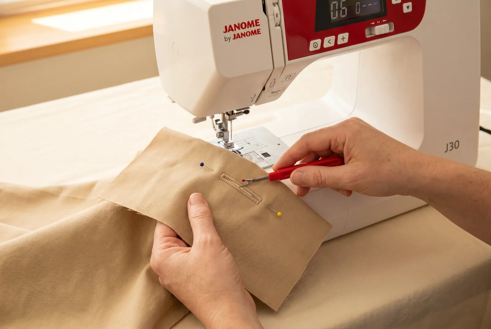 Photo: Raise the foot and remove the fabric.