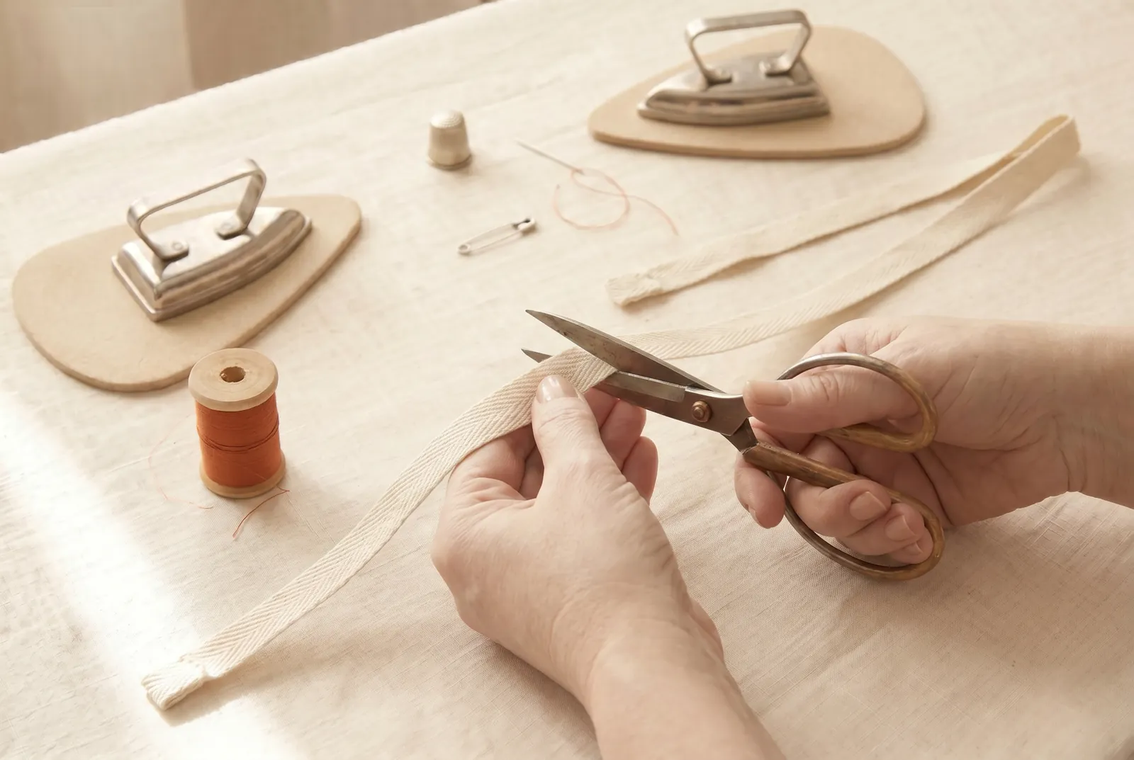 Photo: Cut two drawstrings from tape, braid, or cord, each about 60 cm (24 in) long.
