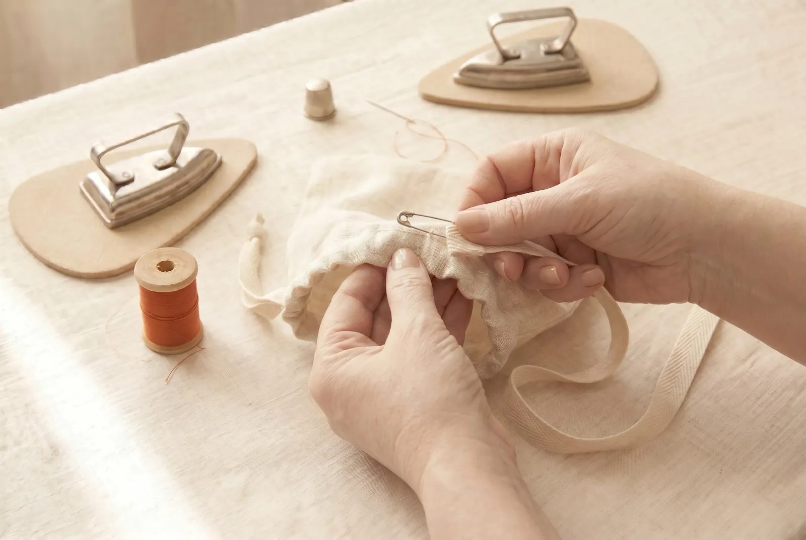 Photo: Pin a bodkin or small safety pin to one string, feed it into one side opening, run it all the way around the casing, and bring it back out the same opening it…
