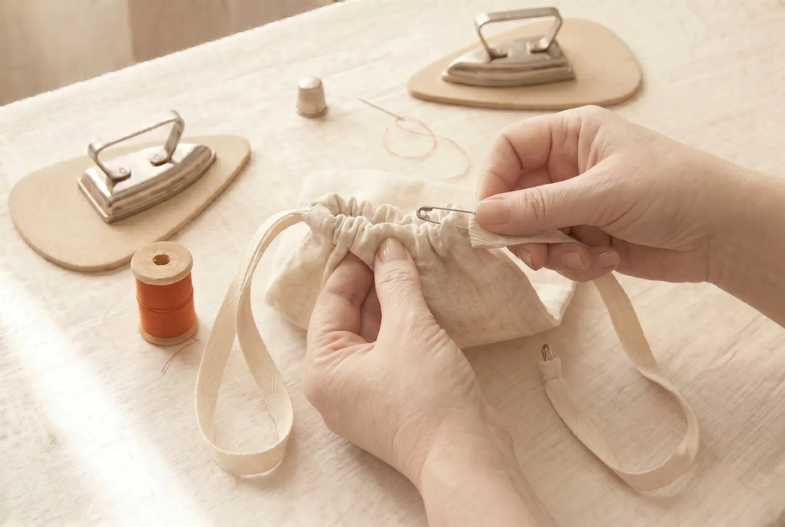 Photo: Thread the second string the same way, but start it from the opening on the opposite side, and join its ends.
