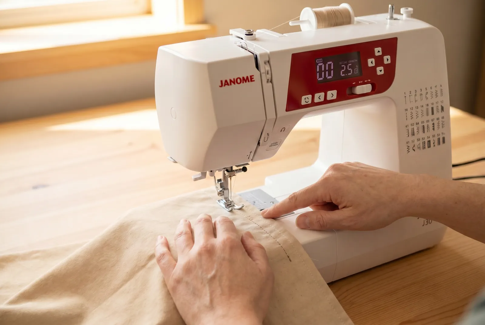Photo: Sew forward at a steady moderate speed, keeping the fabric edge riding against the 1.5 cm line the whole way.