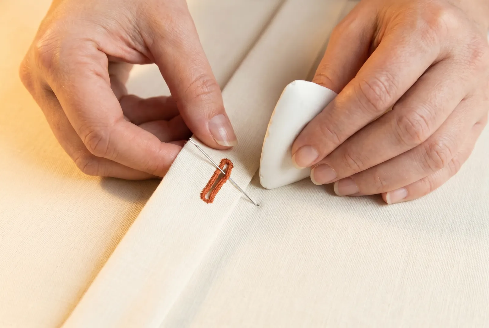 Photo: Lap the closing the way it will be worn and pass a pin straight down through the outer end of the buttonhole.