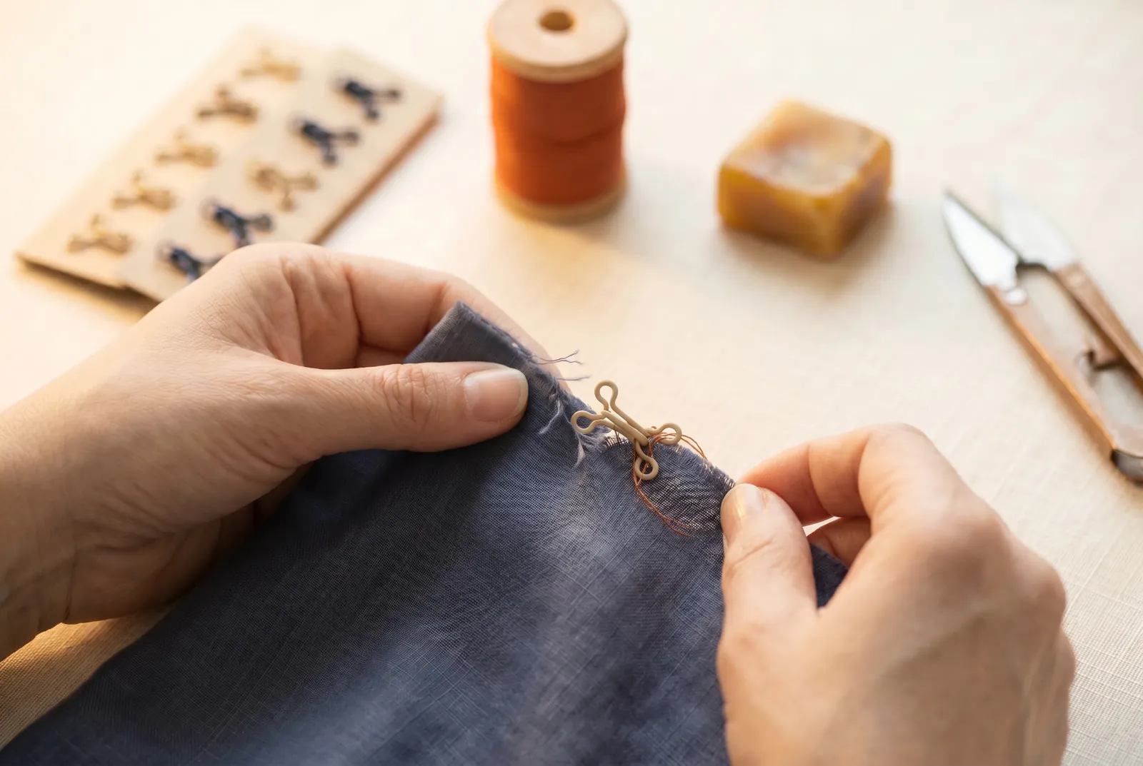 Photo: If a hook or eye is loose, set that garment aside to fix before its next wash.