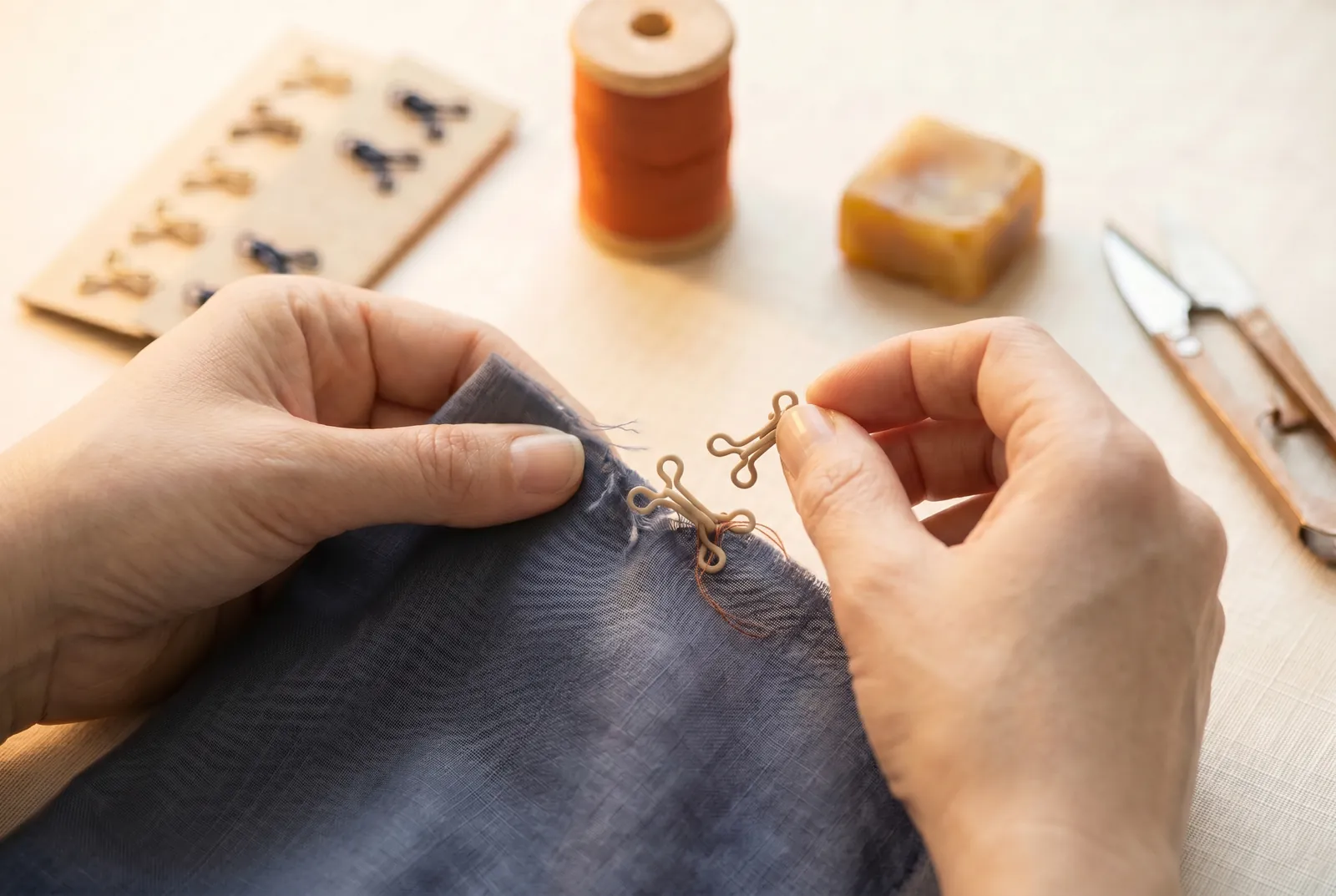 Photo: Handle a loose or missing fastener in the same sitting you find it, rather than setting the garment back on the pile.