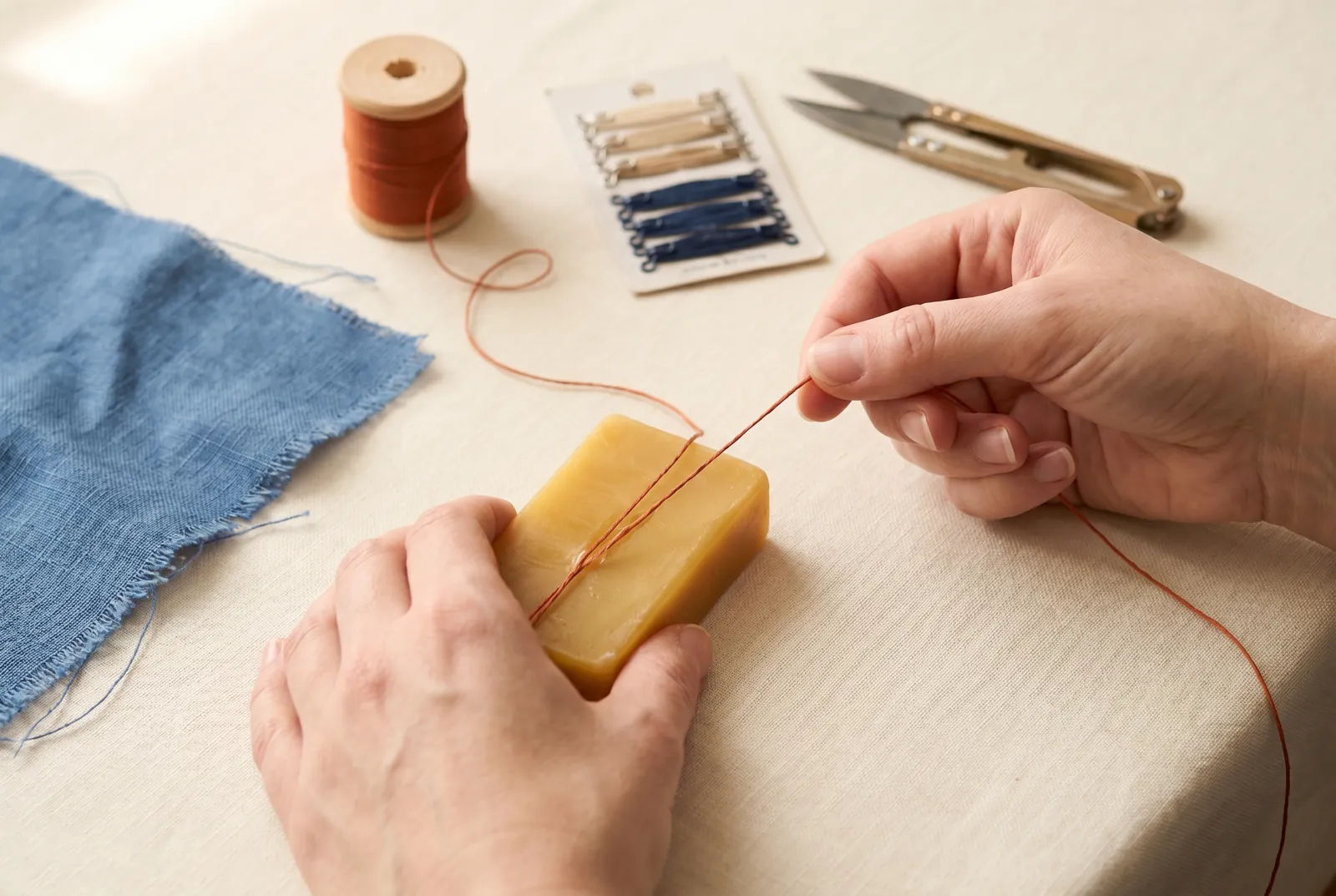 Photo: Draw a length of your repair thread — cotton No.