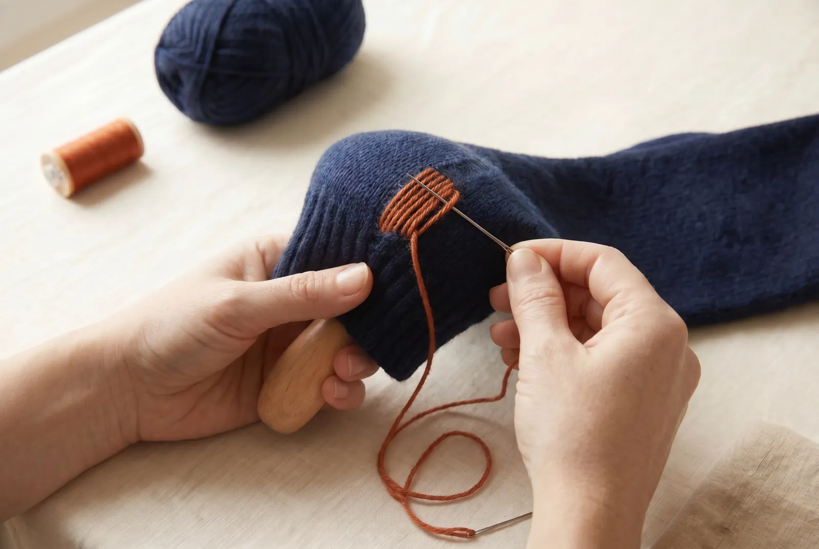 Photo: Repeat the duplicate stitch across the whole thin area, working row by row and following the columns of loops.