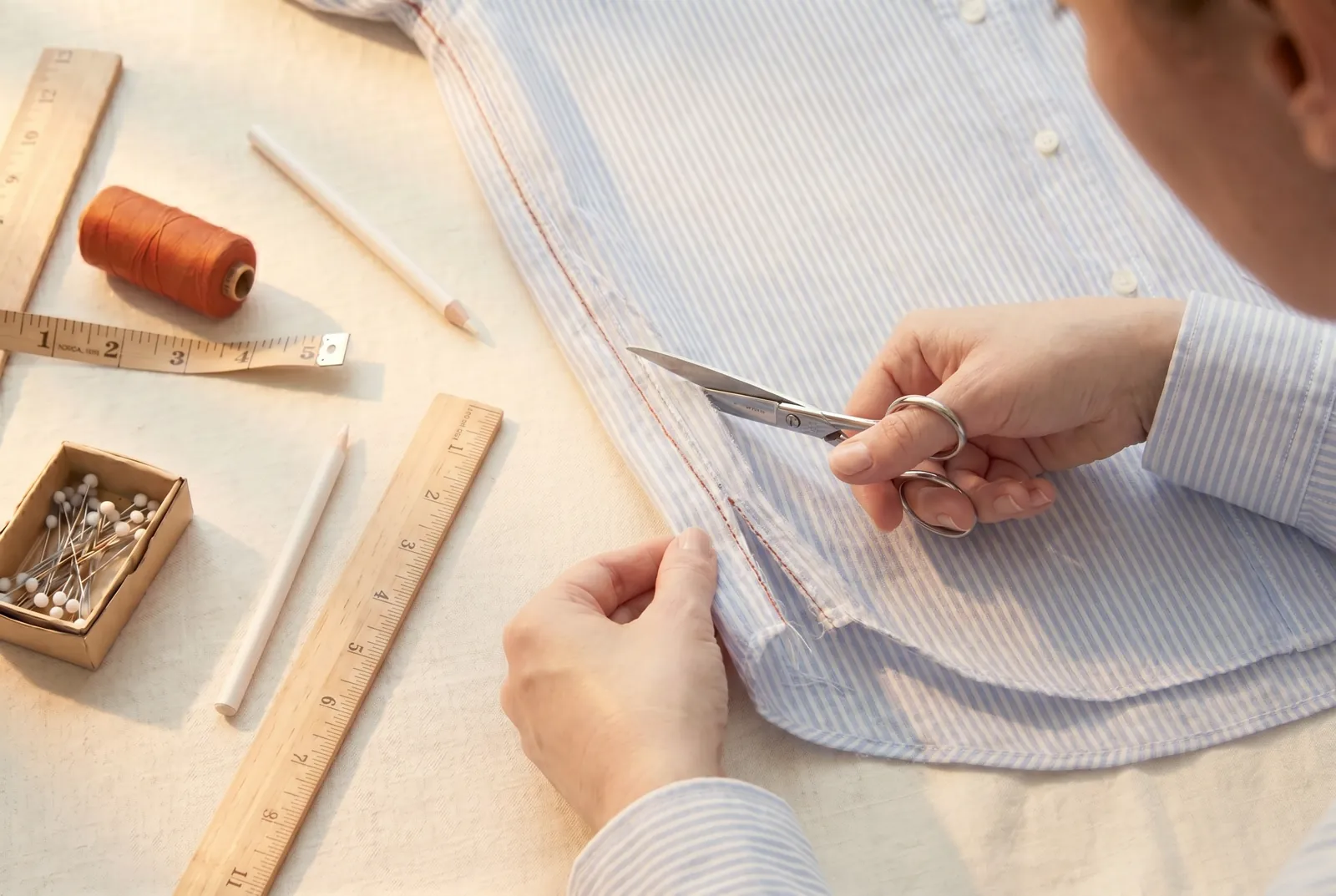 Photo: Draw a cutting line 1 cm (3/8 in) outside the new seamline, then cut along it through both layers from the hem up to the point where your new line rejoins the…