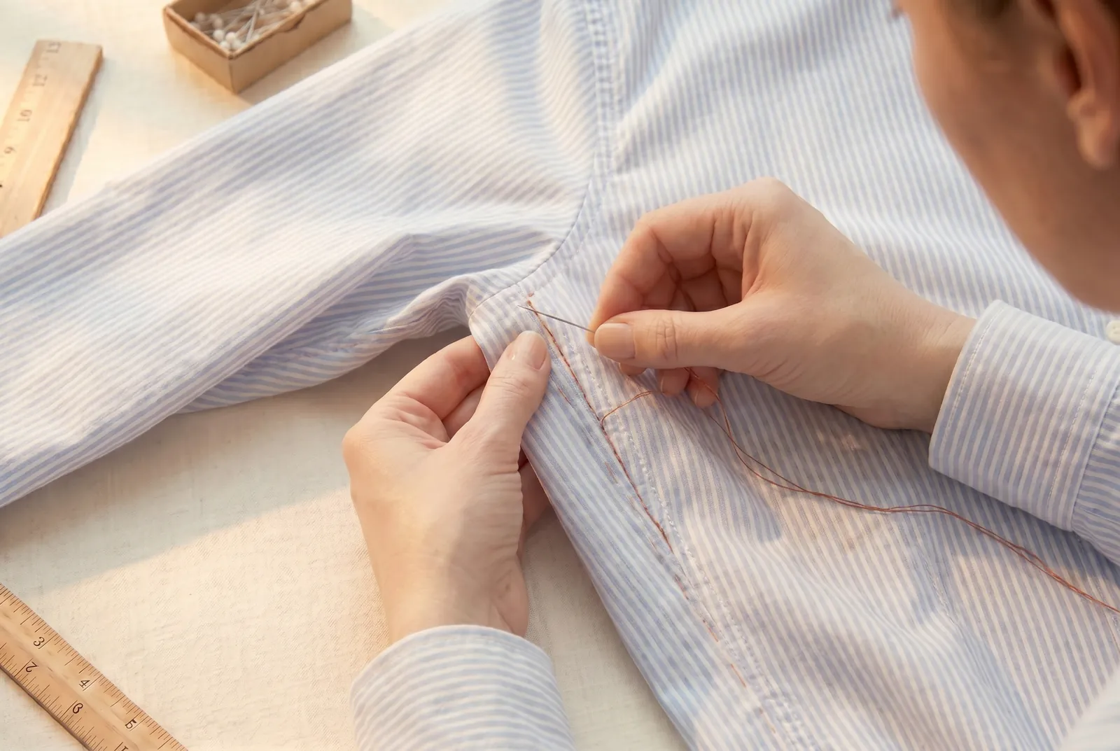 Photo: End both lines of stitching where your new seam meets the original one, a few centimetres below the underarm, and leave the original seam and the armhole above…