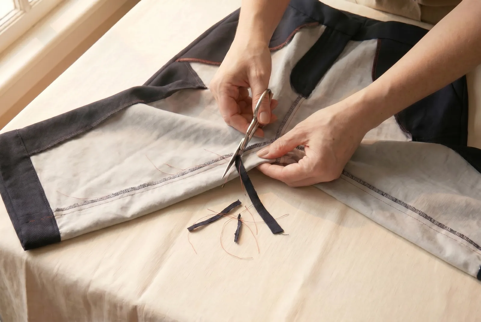 Photo: If you took in more than about 3 cm (1 1/4 in), trim the new seam allowance to an even width so the leg is not bulky.