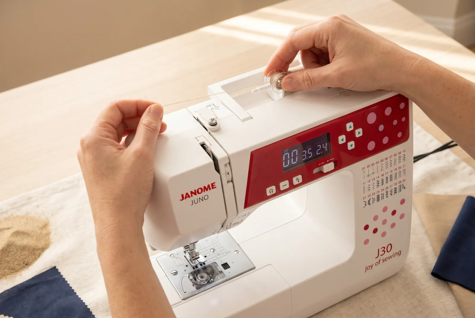 Photo: Place an empty bobbin on the bobbin-winder spindle so the slot in its side lines up with the small pin on the spindle.