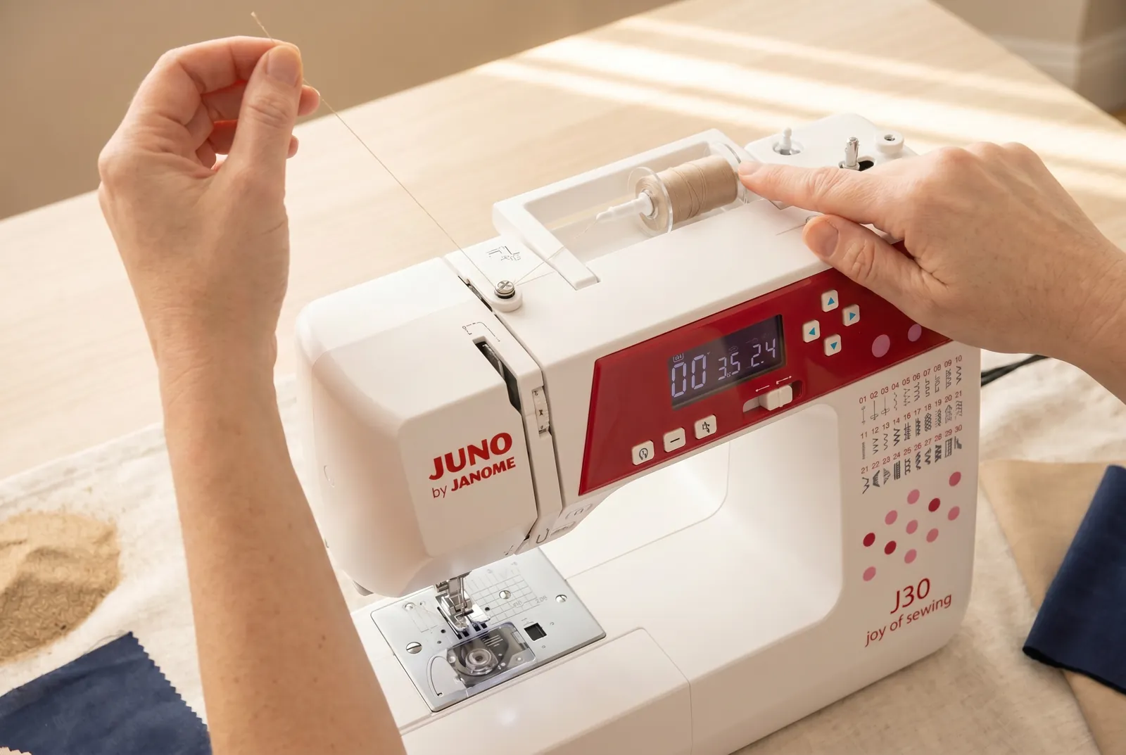 Photo: Push the bobbin-winder spindle to the right until it clicks — this engages the winder and automatically disengages the needle, so the needle will not move whil…