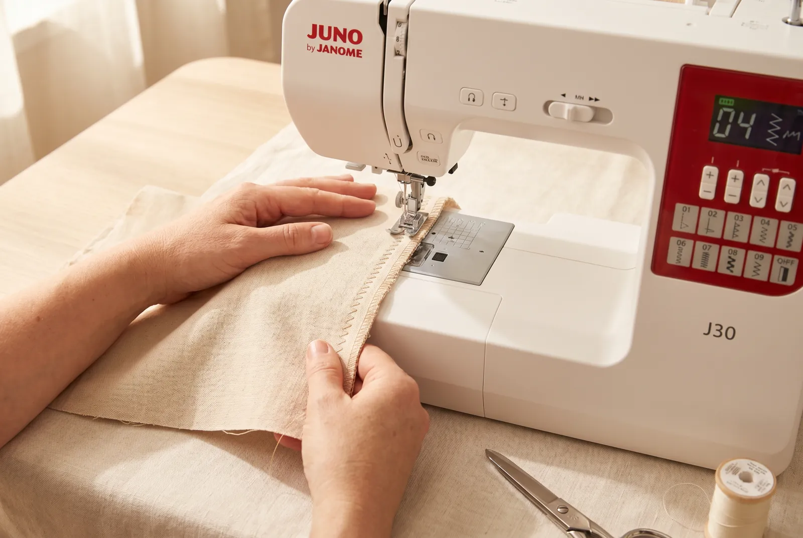 Photo: Position the fabric so the raw edge runs under the centre of the foot: on the left swing the needle sits in from the edge, and on the right swing it drops righ…