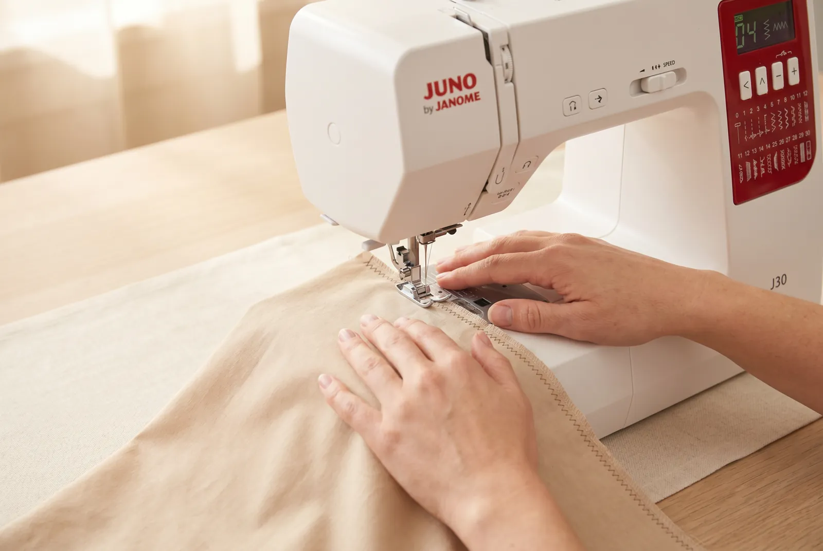 Photo: Stitch the length of the raw edge at a steady moderate speed, keeping your eyes on the edge ahead of the needle rather than on the needle itself.